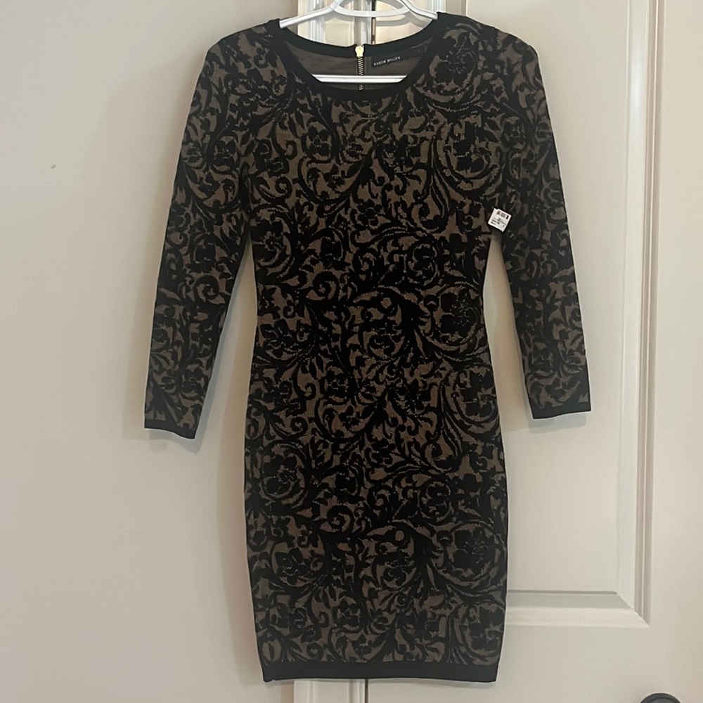 This Karen Millen bodycon dress is never worn and in perfect condition.